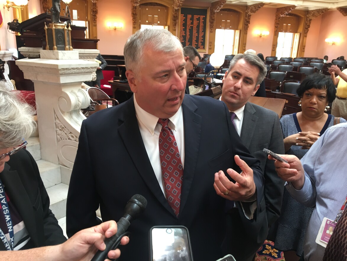 Speaker Larry Householder (R-Glenford) talks to reporters after a House session in June.